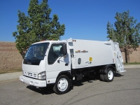 2006 Isuzu NQR with New Way Diamondback 8 Yard Rear Load Refuse Truck