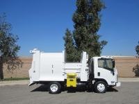 2008 Isuzu NPR with Wayne Tomcat 6 Yard Side Load Refuse Truck