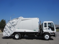 2004 GMC T7500 with McNeilus 17 Yard Rear Loader Refuse Truck