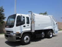 1999 GMC T8500 with McNeilus 17 Yard Rear Load Refuse Truck