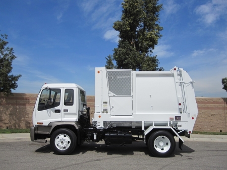 2007 GMC T7500 with Heil Retriever Satellite 10 Yard Side Load Refuse Truck