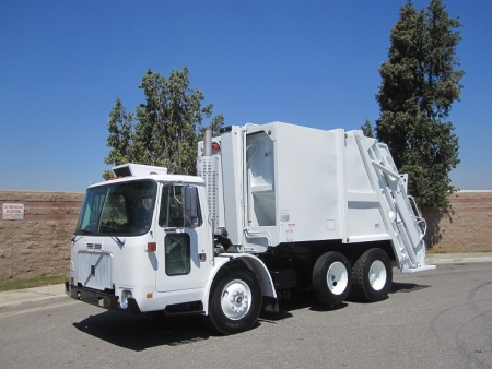 2000 Volvo WXLL64 Xpeditor with Pak-Mor R116 16 Yard Rear Load Refuse Truck