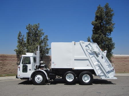 2000 Volvo WXLL64 Xpeditor with Pak-Mor R116 16 Yard Rear Load Refuse Truck