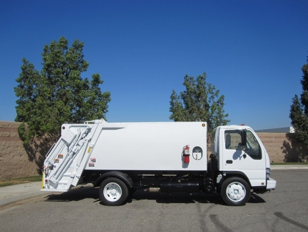 2006 Isuzu NQR with New Way Diamondback 8 Yard Rear Load Refuse Truck