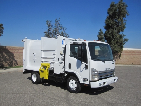 2008 Isuzu NPR with Wayne Tomcat 6 Yard Side Load Refuse Truck