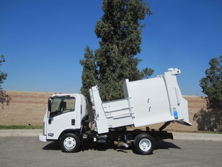 2008 Isuzu NPR with Wayne Tomcat 6 Yard Side Load Refuse Truck