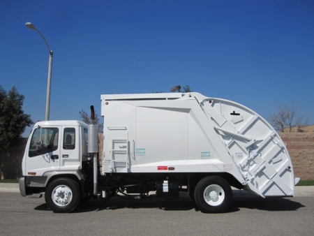 2004 GMC T7500 with McNeilus 17 Yard Rear Loader Refuse Truck