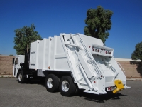 2010 Crane Carrier LET with Pak-Mor 25 Yard Rear Loader Refuse Truck