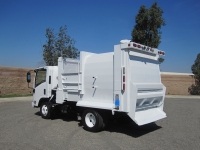 2008 Isuzu NPR with Wayne Tomcat 6 Yard Side Load Refuse Truck