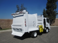 2008 Isuzu NPR with Wayne Tomcat 6 Yard Side Load Refuse Truck