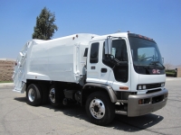 1999 GMC T8500 with McNeilus 17 Yard Rear Load Refuse Truck