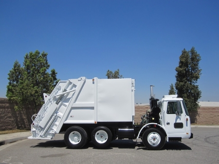 2000 Volvo WXLL64 Xpeditor with Pak-Mor R116 16 Yard Rear Load Refuse Truck