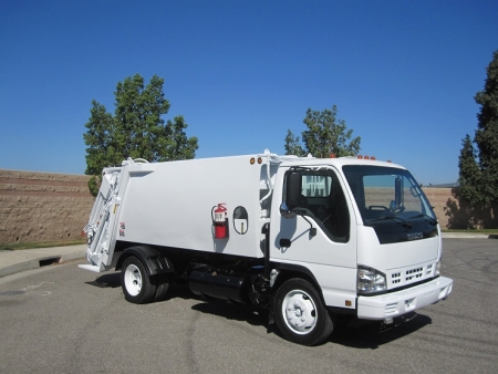 2006 Isuzu NQR with New Way Diamondback 8 Yard Rear Load Refuse Truck