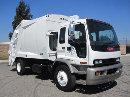 2004 GMC T7500 with McNeilus 17 Yard Rear Loader Refuse Truck