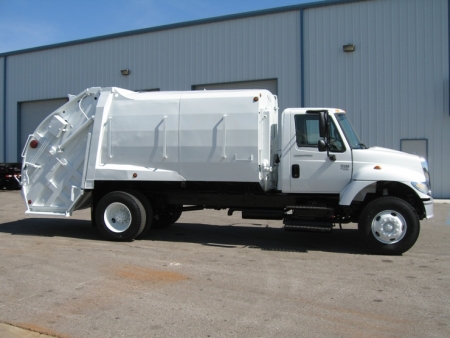 2004 International 7300 with McNeilus 17yd Rear Loader Refuse Truck